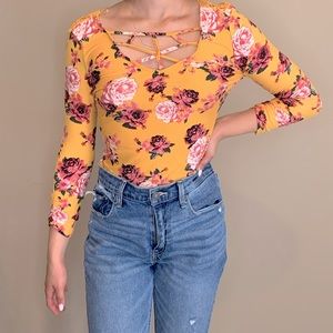 Floral yellow top with design on front